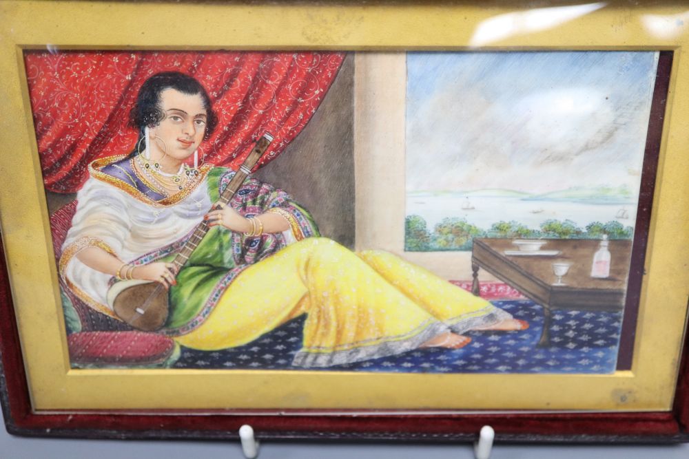 A late 19th century Indian School, gouache, lady playing a sitar